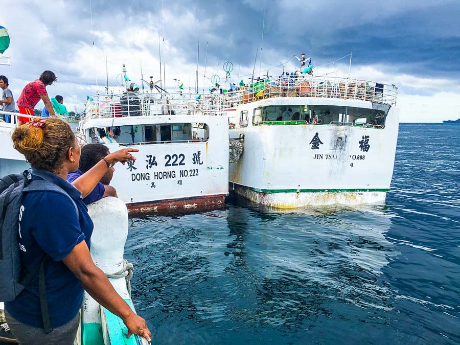 Female compliance officer and two longline fishing vessels Solomon Islands. Photo Francisco Blaha.