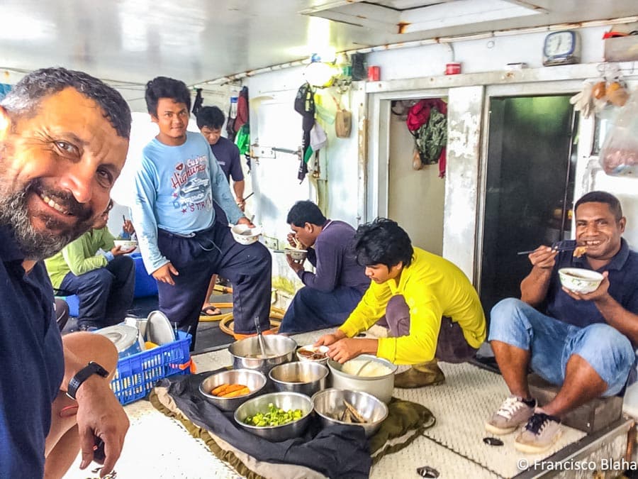 The crew breaks for lunch when Francisco (far left) is on board controlling transhipment at Noro, in the Solomon Islands. (Photo: Francisco Blaha)