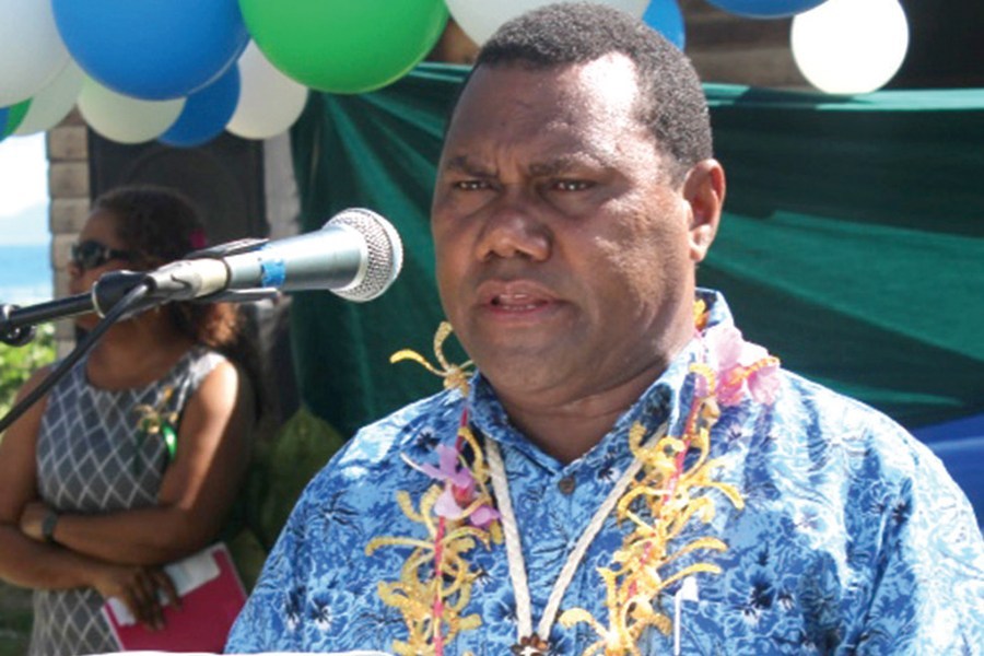 Head and shoulders photo of The Director of Fisheries for the ministry of Fisheries & Marine Resources, Mr Edward Honiwala standing behind microphone