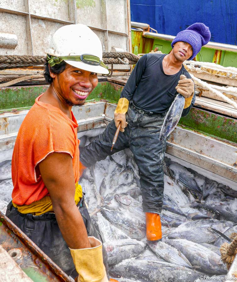 Two men stand in open hatch on frozen tuna. Photo Francisco Blaha.