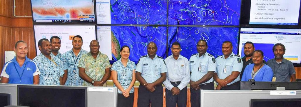 Executive officers of the RSIPF, FFA Director-General, Dr Manumatavai Tupou-Roosen (6th from left), FFA Director Fisheries Operations, Allan Rahari (7th from left), and FFA RFSC staff inside the surveillance centre. Photo: RSIPF Media Unit.